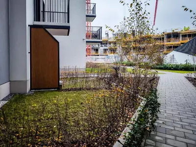 a building with a wooden door on the side of it at GH Luxury Apartment in Kraków