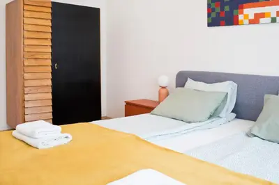 a bedroom with a bed with two towels on it at Beautiful & Cozy Apartment next to Main Market in Kraków
