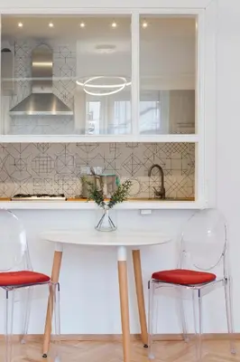 a kitchen with a white table and two chairs at Beautiful & Cozy Apartment next to Main Market in Kraków