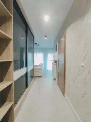 a hallway of a house with a room with glass at Klimeckiego 8a by Homeprime in Kraków