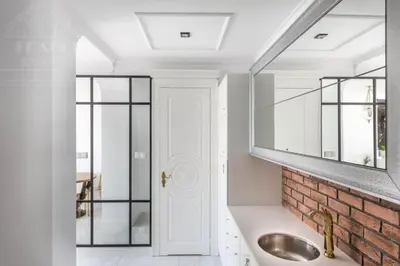 a bathroom with a sink and a mirror at Fragola Apartments Piłsudskiego 11 in Kraków