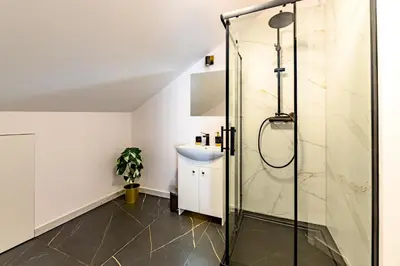 a bathroom with a shower and a sink at Apartament 5th floor in Kraków
