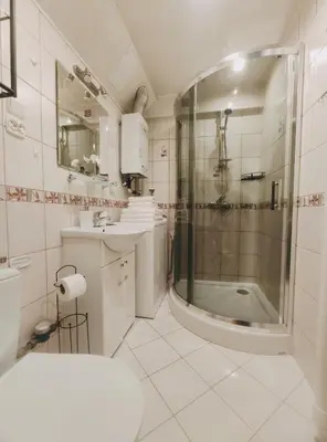 a bathroom with a shower and a sink at Pielęgniarek 5 by Homeprime in Kraków