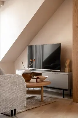 a living room with a tv and a couch and a table at Rooftop Apartment with Terrace by T in Kraków