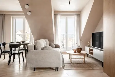 a living room with a couch and a table at Rooftop Apartment with Terrace by T in Kraków