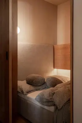 a bedroom with a bed with two pillows on it at Rooftop Apartment with Terrace by T in Kraków