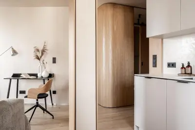 a kitchen with a white refrigerator and a table at Rooftop Apartment with Terrace by T in Kraków