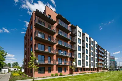 an apartment building with a red and white at In Gold Apartment in Kraków