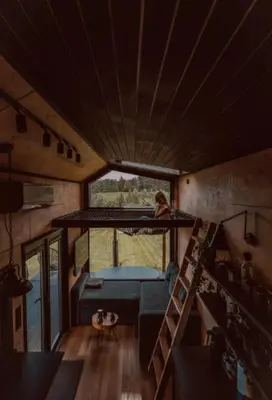 a small cabin in the middle of a field at oto.tinyhouse in Rokiciny Podhalanskie