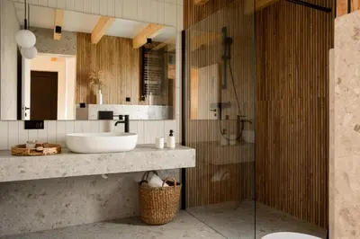 a bathroom with a sink and a shower at NALAS domki z widokiem in Rabka