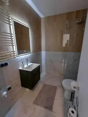 a bathroom with a sink and a toilet at Wielicka Apartment 3 in Kraków