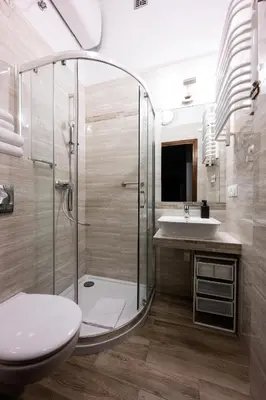 a bathroom with a shower and a toilet and a sink at Native Apartments Skawińska 5 in Kraków
