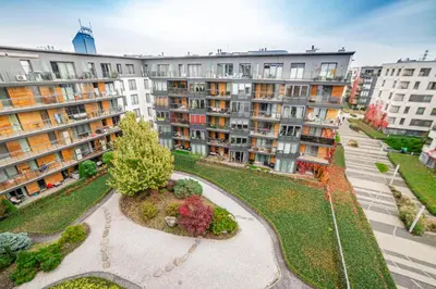 an aerial view of a city with apartment buildings at Bulwar Kurlandzki Vistula Apartment by BookingHost in Kraków