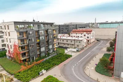 an aerial view of a city with buildings and a road at Bulwar Kurlandzki Vistula Apartment by BookingHost in Kraków
