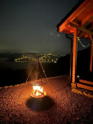 a lit lantern sitting on top of a building at night at Domek Leo's House in Jaszczurowa