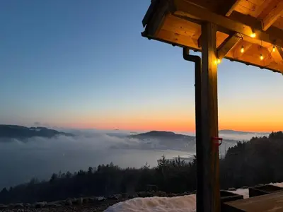 a view from a cabin with a view of a foggy mountain at Domek Leo's House in Jaszczurowa