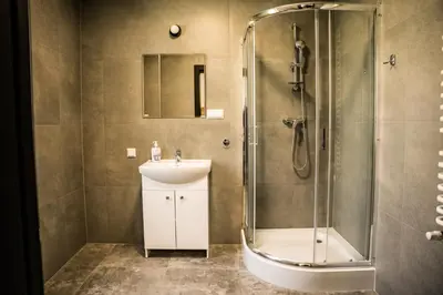 a bathroom with a shower and a sink at Apartamenty W Centrum Chrzanowa in Chrzanów