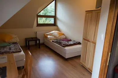 a small room with a couch and a window at Agroturystyka Podzamcze in Krzeszowice