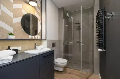 a bathroom with a shower and a toilet and a sink at GO Apartments Studio with Balcony Rakowicka Cracow by Noclegi Renters in Kraków