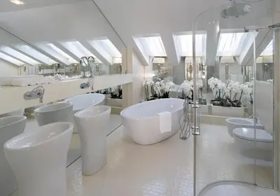 a bathroom with four sinks and a tub and mirrors at Kanonicza 22 in Kraków