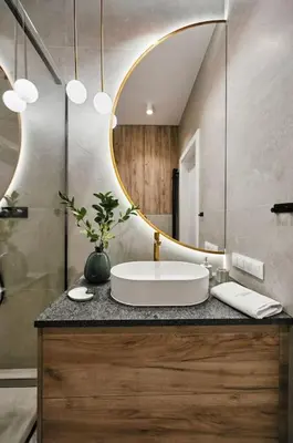a bathroom with a sink and a mirror at Golden Dreams Luxury Apartments 103 in Kraków