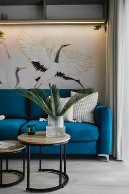 a living room with a blue couch and a table at Golden Dreams Luxury Apartments 103 in Kraków