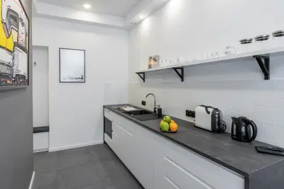 a kitchen with a sink and a counter top at NEW APARTMENT! Jewish quarter! in Kraków