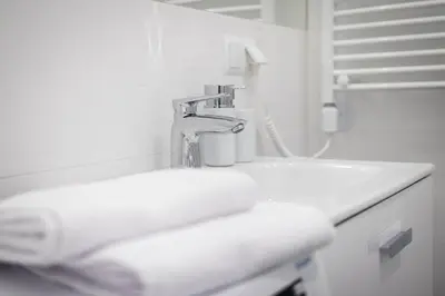 a bathroom with a sink and a faucet at NEW APARTMENT! Jewish quarter! in Kraków