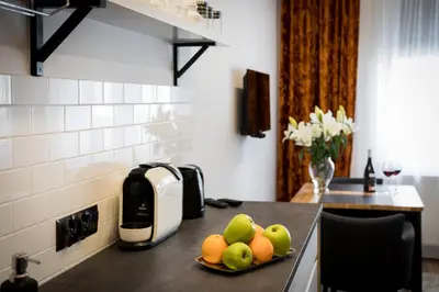 a kitchen with a plate of fruit on a counter at NEW APARTMENT! Jewish quarter! in Kraków