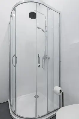 a shower with a glass enclosure in a bathroom at NEW APARTMENT! Jewish quarter! in Kraków