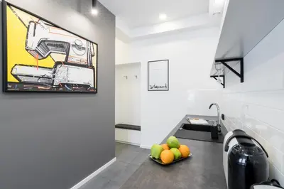 a kitchen with a sink and a bowl of fruit at NEW APARTMENT! Jewish quarter! in Kraków