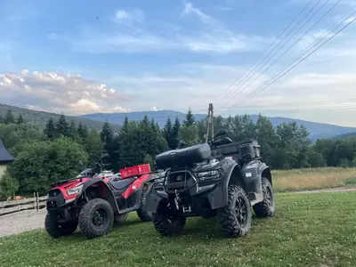 two atvs parked on the side of a road at Zawoja Nad Koroną z jacuzzi in Zawoja