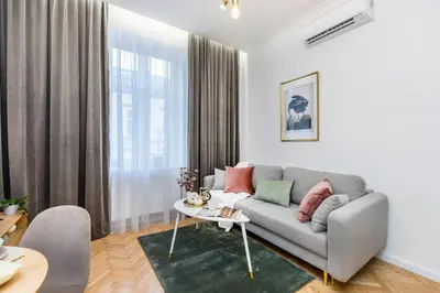 a living room with a couch and a table at Wielopole 7 Apartment 2 rooms in Kraków