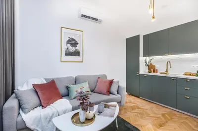 a living room with a couch and a table at Wielopole 7 Apartment 2 rooms in Kraków