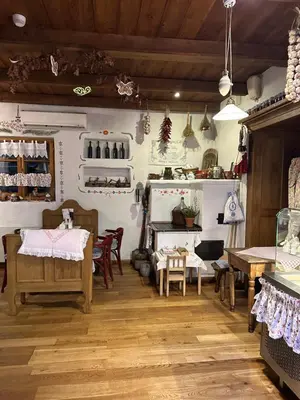 a store with tables and chairs in a room at Restauracja i Hotel Oberża Wilczy Głód in Krzyszkowice