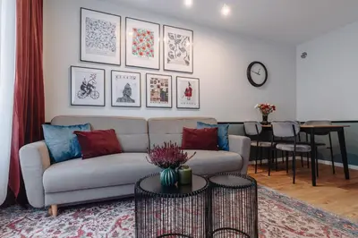 a living room with a couch and a table at Tomasza 25 Apartament 3 in Kraków