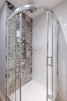 a shower with a glass enclosure in a bathroom at Tomasza 25 Apartament 3 in Kraków