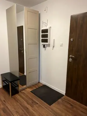 a room with a hallway with a door and a television at Mieszkaj U Marty w GRÓDKU in Jaworzno