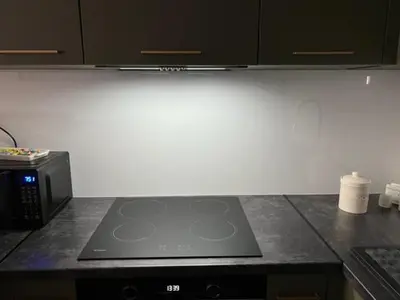 a kitchen counter top with a stove and a microwave at Mieszkaj U Marty w GRÓDKU in Jaworzno