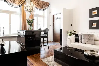 a living room with a couch and a table at Househost Apartment:Łobzowska 22 in Kraków
