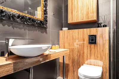 a bathroom with a white sink and a toilet at Househost Apartment:Łobzowska 22 in Kraków