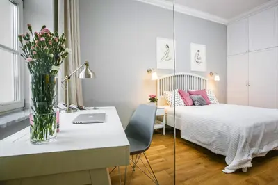 a living room with a couch and a table at MINT Luxury Apartments at the Main Square in Kraków