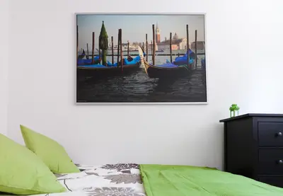 a bedroom with a picture of gondolas on the water at Kraków Cosy 3 room 2 bathroom Old Town in Kraków