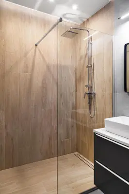a bathroom with a shower and a sink at HOUSEHOST Apartment: Miodowa 42/12a Street in Kraków
