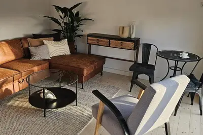 an overhead view of a living room with a couch and chairs at Green corner in Kraków