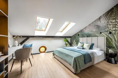 two pictures of a bathroom with a sink and a mirror at Skyline by MB Apartments in Kraków