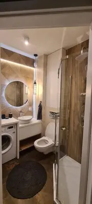a bathroom with a toilet and a sink and a shower at Rydlowka 21 apartament in Kraków