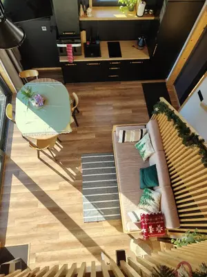 an overhead view of a living room with a couch and a table at Domek Ponad Mgłami in Laskowa