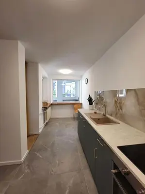 a kitchen with a sink and a counter top at Mieszkanie na Starym Podgórzu. in Kraków