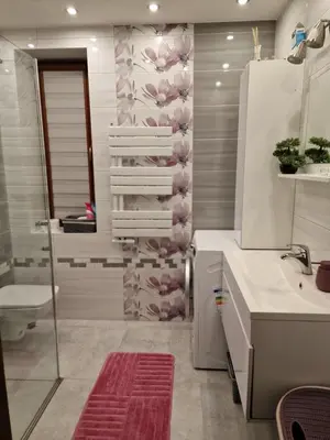 a bathroom with a shower and a sink and a toilet at Dom w górach in Lipnik